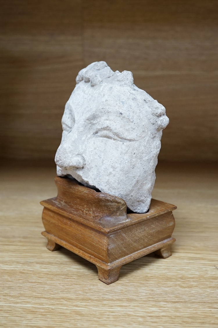 A stucco work Buddha head, possibly Tang Dynasty, 15.5cm high. Condition - fair